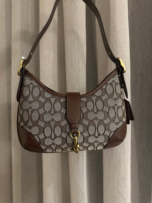 Signature jacquard canvas in a beige/taupe and brown pattern